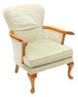 A mahogany armchair, upholstered in green fabric, the shaped arms carved with eagles heads, on cabriole legs. The upholstery in this lot does not comply with the 1988 (Fire & Fire Furnishing) Regulations, unless sold to a known exporter or upholsterer it 