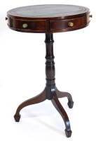 A mahogany drum top occasional table, with a leather top, turned column and spade feet, 45cm diameter.