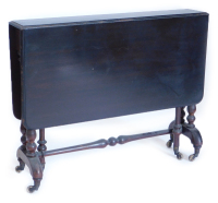 A late Victorian ebonised mahogany Sutherland table, the rectangular top with a moulded edge and rounded corners, on turned end supports with castors, 90cm wide.