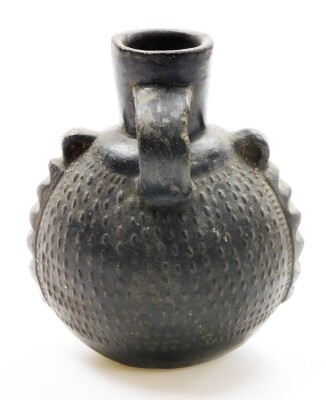 A Chinese pottery ovoid ewer with single handle and relief decorated body, 19thC or earlier, 20cm high. - 25