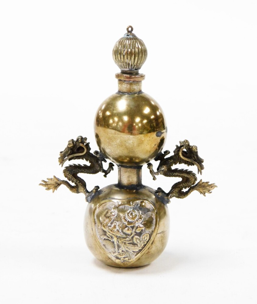 A Chinese bronze opium bottle, with integral spoon stopper, dragon mounts...