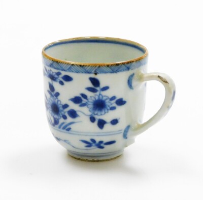 A group of Chinese blue and white cups, to include a Chinese blue and white tea bowl 8cm wide, a coffee can lacking handle, 6cm diameter, and a teacup with floral decoration, 18thC. (3) - 23