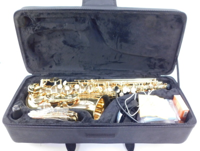 An Evette brass saxophone by Julius Keilwerth, with mother of pearl keys, serial no GEA60899, cased.