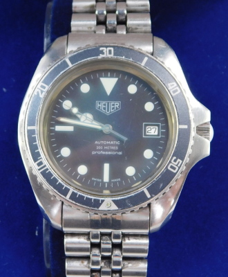 A Heuer gentleman's automatic 200m professional stainless steel case wristwatch, circular black dial, with centre seconds, date aperture, black rotating bezel, back plate engraved Etanche Acier - Automatic 844/3, on a bracelet strap, boxed. - 3