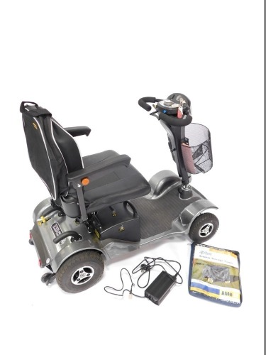 A Sterling Sapphire 2 four wheel mobility scooter, with leatherette seat, battery charger, front basket and key, plastic cover (still in packaging), 92cm high. Please note: We are advised by the vendor that this is as new condition as only used for a very