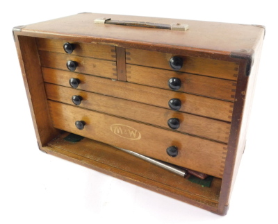 A Moore & Wright oak cased mechanical tool chest, containing micrometres, calipers and other precision instruments, the fall flap opening to reveal four short and three long graduated drawers, with carrying handle. - 2