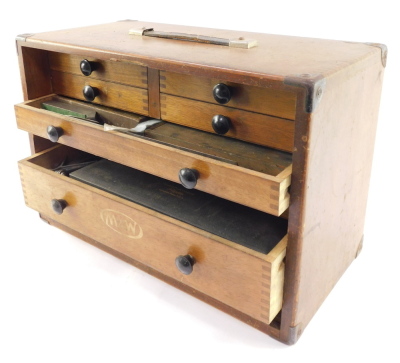 A Moore & Wright oak cased mechanical tool chest, containing micrometres, calipers and other precision instruments, the fall flap opening to reveal four short and three long graduated drawers, with carrying handle. - 4