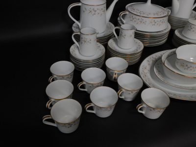 A Noritake porcelain part dinner tea and coffee service decorated in the Estrellita pattern, comprising a pair of graduated meat platters, integrated sauce boat on stand, oval serving dish, vegetable tureen and cover, eight dinner, dessert and side plates - 3