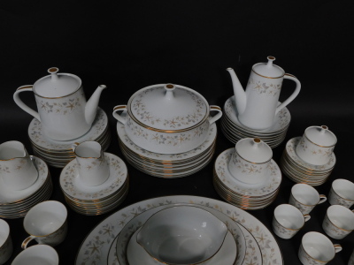 A Noritake porcelain part dinner tea and coffee service decorated in the Estrellita pattern, comprising a pair of graduated meat platters, integrated sauce boat on stand, oval serving dish, vegetable tureen and cover, eight dinner, dessert and side plates - 4