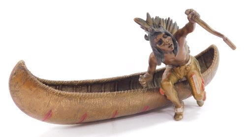 A Franz Bergman cold painted bronze model of a Native American Indian, seated in a canoe, impressed mark and numbered 3603 to underside, 26cm wide.