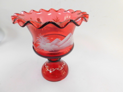 A Victorian cranberry glass vase, decorated in the Mary Gregory style, having a wavy rim and a band of a figure in landscape with bird to the bowl, and scrolls to stepped base, 26cm high. - 2