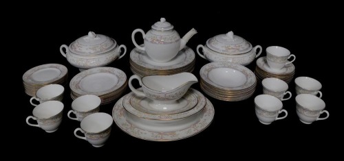 A Royal Worcester porcelain tea and dinner service decorated in the Lagoon pattern, comprising bullet shaped teapot, nine tea cups, seven saucers, ten tea plates, twelve side plates, one oval platter, one oval vegetable dish, nine dinner plates, two circu