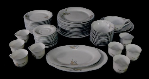 A Winterling Marktleuthen of Bavaria tea and dinner service, comprising twelve dinner, dessert, bowls, saucers, eight cups, two serving bowls, one large circular plate, sauce boat, gravy boat and oval dishes.