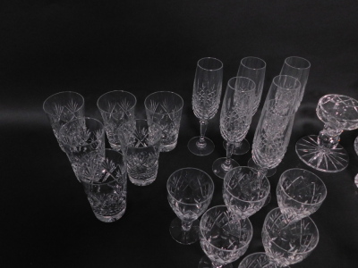 An extensive suite of cut crystal drinking glasses, together with a 'Georgian Crystal' globe and shaft decanter, ornamental shoe, and a water jug (AF). (a quantity) - 5