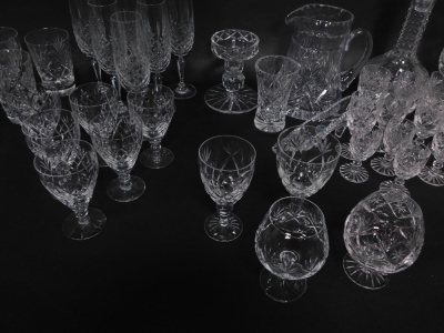 An extensive suite of cut crystal drinking glasses, together with a 'Georgian Crystal' globe and shaft decanter, ornamental shoe, and a water jug (AF). (a quantity) - 6