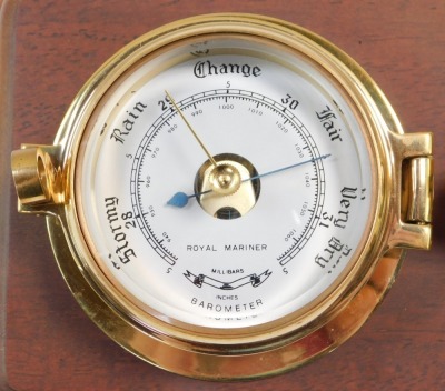 A Royal Mariner brass two dial wall clock and barometer, the clock with quartz movement, the case of porthole form on a wooden backing, 29cm wide., together with a Sewills barometer with thermometer and hygrometer, under a plastic dome, 17cm high. (2) - 5