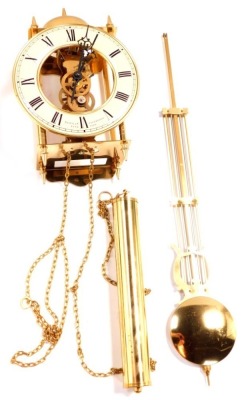 A Sewills of Liverpool brass cased skeleton lantern wall clock, circular dial with chapter ring bearing Roman numerals, single train movement with bell strike, and pendulum, No 701 - 781.