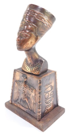 A copper 20thC bust of Queen Nefertiti, raised on a stand embossed with a vulture and hieroglyphs, on a wooden base, 19cm high.