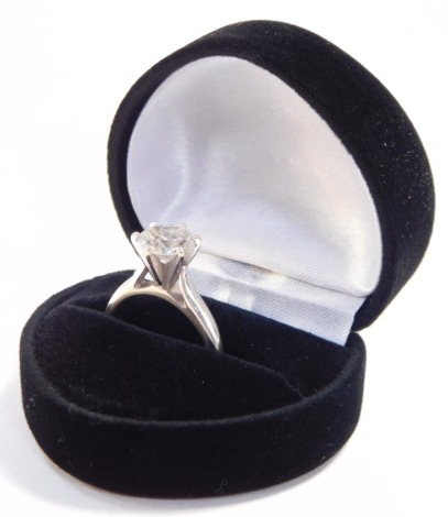 A diamond solitaire ring, high claw set in white metal, stamped 14k, approximately 2cts, size J/k, 4.4g.