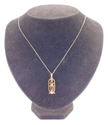 An Egyptian hieroglyph pendant, yellow metal, on a belcher link neck chain, stamped 585, 4.2g all in. - 3