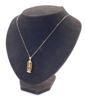 An Egyptian hieroglyph pendant, yellow metal, on a belcher link neck chain, stamped 585, 4.2g all in. - 4