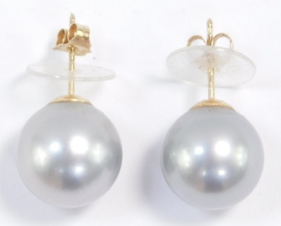 A pair of silver Tahitian cultured pearl earrings, set in yellow metal, stamped 14k, approximately 10mm diameter. - 3