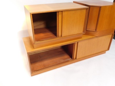 An E Gomme Ltd 1970's teak low corner unit, in three sections, with sliding doors, on a plinth, each 49cm high. - 3