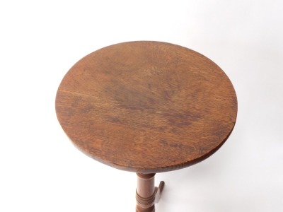 A 19thC oak wine table, the circular top on a turned column and tripod base, the top 36cm diameter. - 2