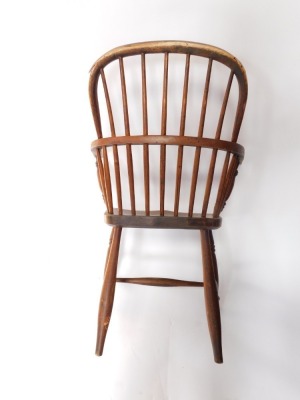 A 19thC ash and elm Windsor chair, the shaped back and arms with spindle turned supports, with solid seat on turned legs with H stretcher. (AF) - 3