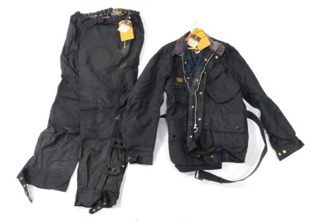 A Barbour International wax jacket, size 44, with matching trousers, waist size 40. (2)