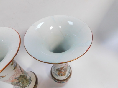 A pair of Japanese Kutani porcelain vases, with flared rim and enamelled and gilt diaper work borders, and the bodies having seated figures, standing sages, etc, on bulbous base with eight character iron red signature, 36cm high. (AF) - 2