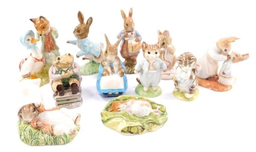 A selection of Beatrix Potter figures by Royal Albert, including Peter With Post Bag, Tom Kitten, Mrs Rabbit and Bunnies, etc. (12)