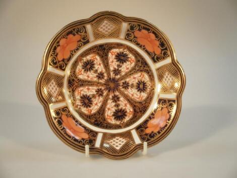 A Royal Crown Derby shaped circular dish with Imari cigar pattern decoration