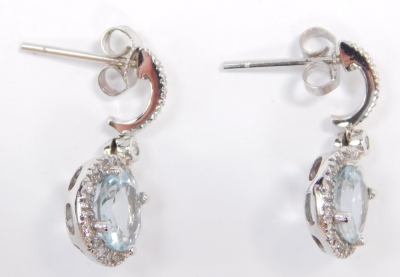 A pair of aquamarine and diamond earrings, in a circular drop and loop design, in white metal stamped 585. - 3