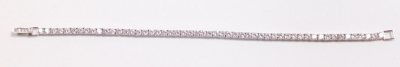 A Crislu CZ platinum on silver tennis bracelet, on a snap clasp, boxed. - 2