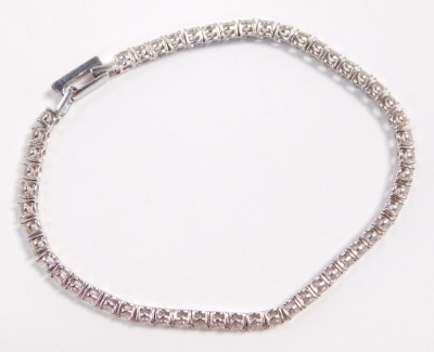 A Crislu CZ platinum on silver tennis bracelet, on a snap clasp, boxed. - 3