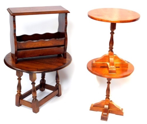 A group of furniture, comprising a pair of oak occasional tables, each with a circular top and turned column, on X shaped base, an oval drop leaf table and a magazine rack. (4)