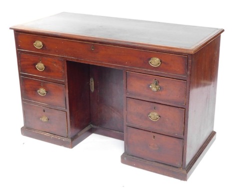 A 19thC mahogany kneehole desk, the top with a green leather insert, above an arrangement of six drawers, each with oval brass drop handles, and a central door, on a plinth, 80cm high, 127cm wide, 57cm deep.