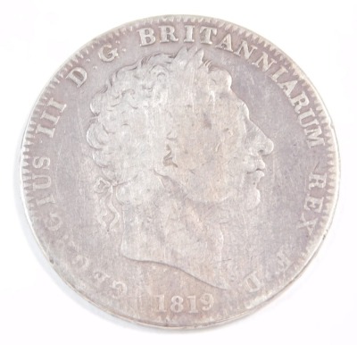 A George III silver crown 1819.