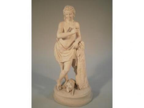 A Victorian Parian figure of Apollo in standing pose resting on a tree