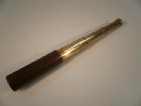 A brass three draw telescope with leather grip, stamped Britannic, BC & Co, made in England.Estimate: 25-40