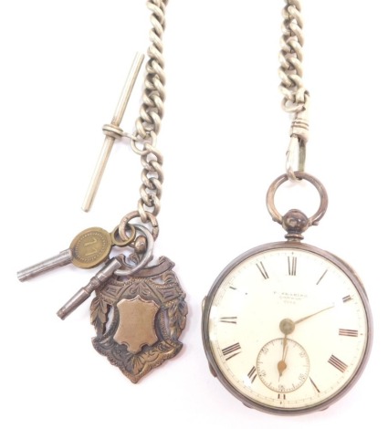 A Victorian gentleman's silver cased pocket watch by F Searing of London, open faced, key wind, circular enamel dial bearing Roman numerals, subsidiary seconds dial, movement no 2214, the case with engine turned decoration, shield reserve, London 1882, wi