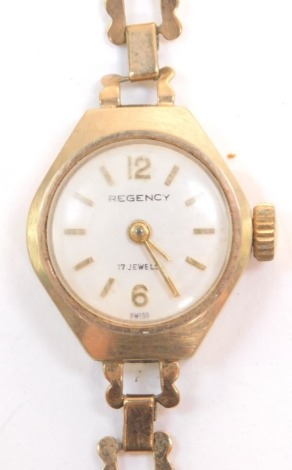 A Regency 9ct gold cased lady's wristwatch, circular silvered dial bearing Arabic numerals at 12 and 6, seventeen jeweled movement, on a gold bracelet strap, 9.9g all in.