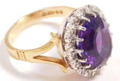 A 18ct gold and amethyst ring, oval cut in a surround of diamonds, amethyst approximately 5ct, size K/L, 6.5g. - 4