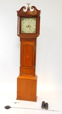 Samuel Deacon, Barton. A George III mahogany and oak long case clock, the square enamel dial painted with floral spandrels, Arabic numerals, date aperture, eight day two train movement with bell strike, the hood with broken arch pediment, raised on brass 