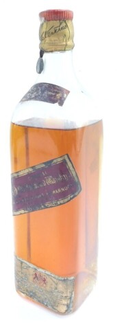 A bottle of John Walker & Sons Kilmarnock Special Old Highland Whisky, Red Label, By Appointment to His Majesty King George V, with a sealed and foiled lid.