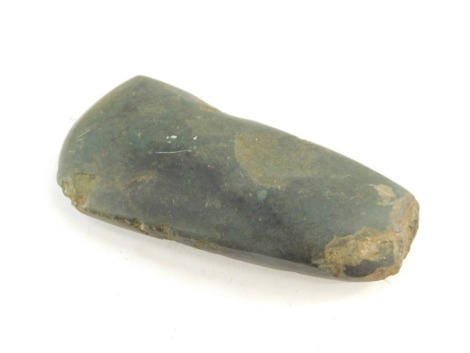 A Neolithic period polished axe head, purportedly found near Amesbury in Wiltshire, 11cm wide.