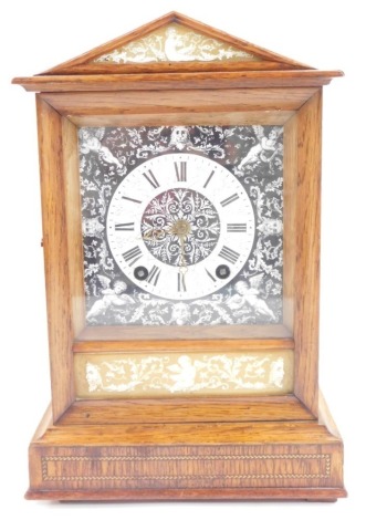 A Winterhalder and Hofmeier late 19thC oak cased mantel clock, the enamel square dial decorated in the Florentine style with cherub's masks and foliate scrolls against a black ground, white chapter ring bearing Roman numerals, eight day movement with coil