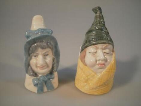 Two Royal Worcester porcelain candle snuffers of 'Mr Caudle and Mrs Caudle'