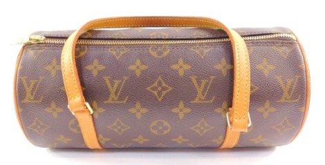 A Louis Vuitton monogram canvas Papillon handbag, with tan leather trim and handle, stamped to interior Louis Vuitton Paris made in USA, with dustbag, 13cm high, 27.5cm wide, 13cm deep.